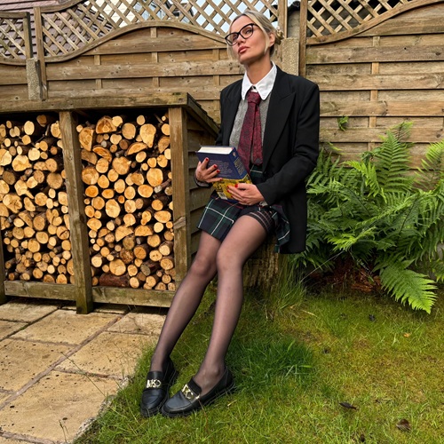 Girl with logs for wood burner Girl with logs for wood burner